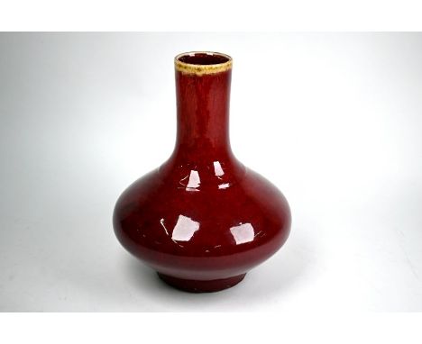 A Chinese Langyao type vase in the 18th century Kangxi style, the compressed body and cylindrical neck covered with a variega