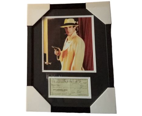 Warren Beatty mounted signed cheque for $300.00 dated November 16th 1976, with colour photo from the 1990 movie Dick Tracy. M