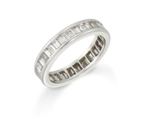 A diamond full hoop eternity ring, with a continuous row of channel set baguette cut diamonds, ring size RCondition Report:  