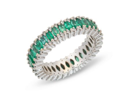 An emerald and diamond full eternity ring,&nbsp;with a continuous row of marquise cut emeralds with a row of brilliant cut di