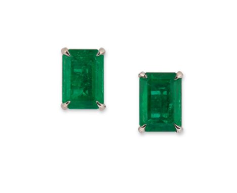 A pair of emerald single stone earrings,&nbsp;each earring with a rectangular step cut emerald, approximately 6.9 x 4.9mm, fo