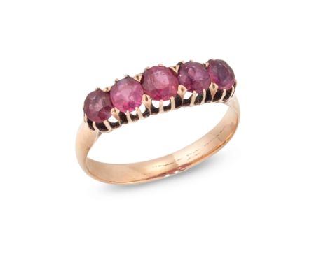 A late 19th century five stone ruby ring,&nbsp;with a row of graduated oval mixed cut rubies, claw set to a plain mount, ring