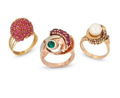 Three rings, comprising: a ruby set bombé cluster ring, with five row wire hoop, stamped 750, ring size Q; a cultured pearl a