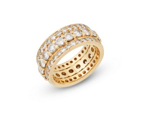 A diamond full hoop ring, a central row of brilliant cut diamonds with rows of smaller brilliant cut diamonds either side, wi