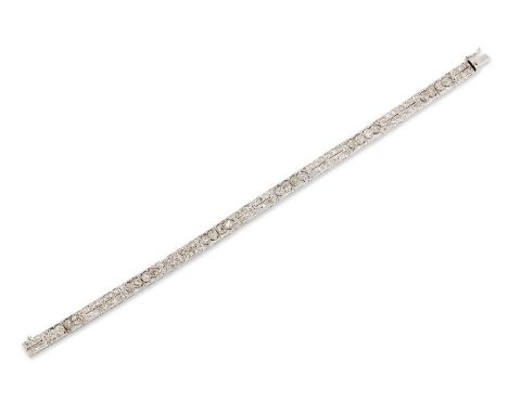 A diamond panel bracelet, with pierced panels set with pairs of old cut diamonds, joined by single cut diamond set panels, to