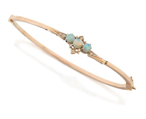 An early 20th century opal and diamond bangle, the upper half set with cabochon opals and rose cut diamonds, (split on one si