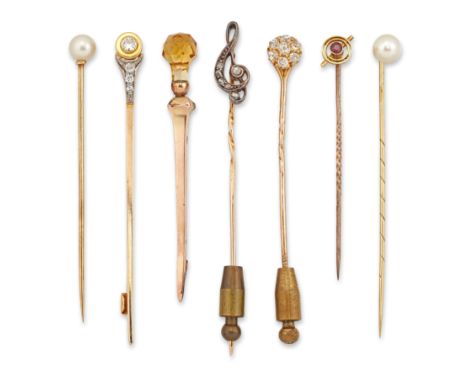 A group of seven gem stickpins and bar brooches,&nbsp;including: a gold and silver mounted rose cut diamond set treble clef s