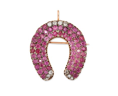A ruby and diamond horseshoe brooch/pendant, set with pav&eacute; circular-cut rubies to old-brilliant-cut diamond accents, t