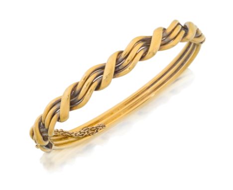 A late 19th century 15ct gold bangle, the upper half of hollow plaited design, to plain three row lower half, stamped 15, int