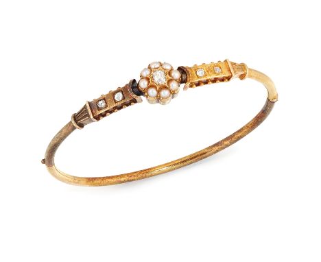 A late Victorian gold diamond and half pearl bangle, of hinged half hoop design, the central section with old brilliant cut d