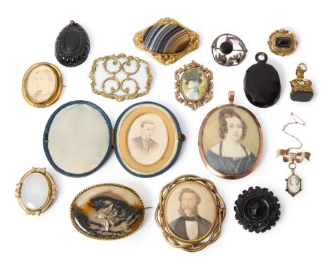 A group of 19th century and later jewellery, including: a carved jet pendant, length 4.6cm; a carved jet locket pendant, leng