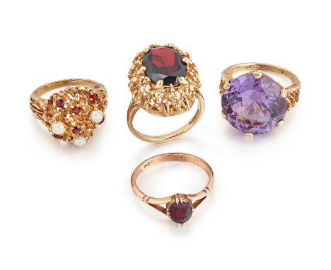 A group of four gem rings, including two garnet single stone rings; a garnet and cultured pearl cluster ring; and a synthetic