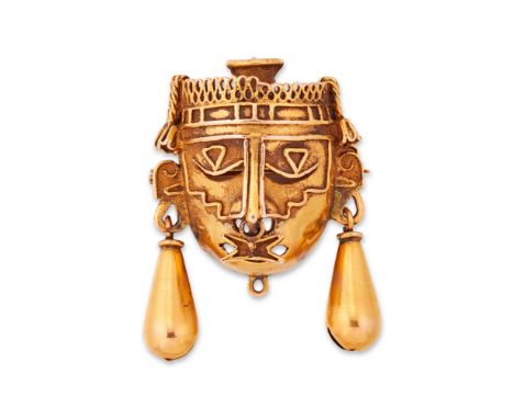 A mask brooch/pendant, depicting Aztec god Xipe Totec, suspending two drops (one lacking), with suspension loop and brooch fi