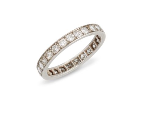 A diamond full eternity ring, with a continuous row of brilliant cut diamonds, grain set to plain guards, width 3.1mm, ring s