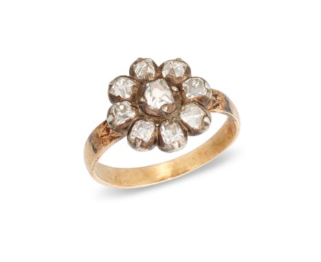 A 19th century diamond cluster ring,&nbsp;the old mine cut diamond cluster mounted on a later gold band, ring size F