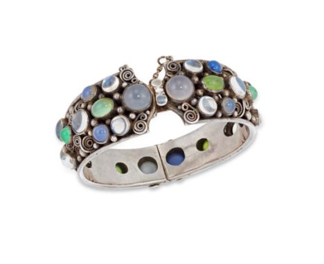 An Arts & Crafts silver and gem set bangle, possibly William Thomas Blackband, of tapering form with collet cabochon moonston