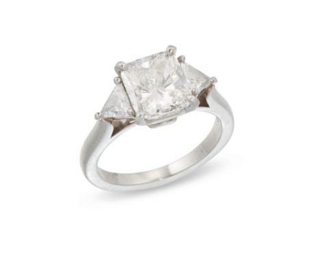 A platinum three stone diamond ring,&nbsp;the central cushion cut diamond with a weight of 2.01 carats, to trilliant cut diam