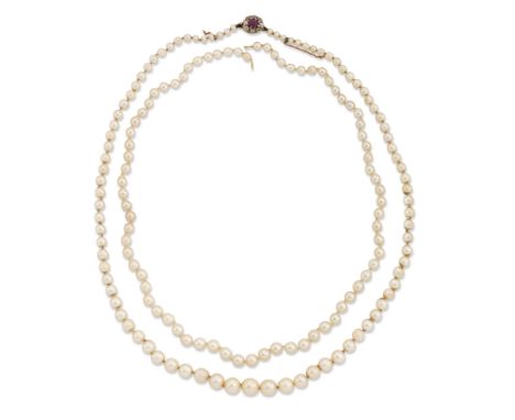A single row cultured pearl necklace with ruby and diamond clasp, the graduated cultured pearls approximately 3.2 to 8.0m in 