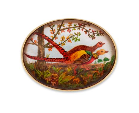 An early 20th century, gold mounted glass reverse painted intaglio brooch, the oval panel depicting two pheasants in woodland