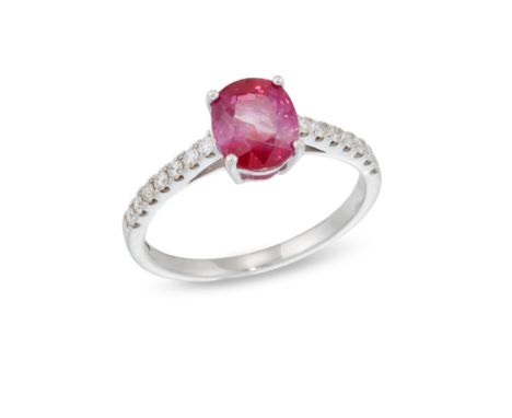 A ruby and diamond ring,&nbsp;the oval mixed cut ruby in four claw setting, to brilliant cut diamond line shoulders and a pla