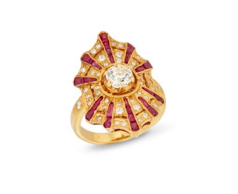 A diamond and ruby panel ring, with a brilliant cut diamond to the centre of a stylised web design panel, with radiating cali