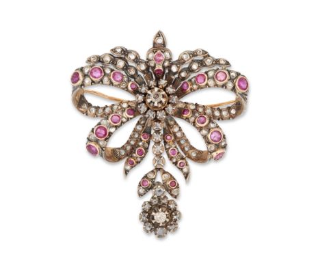 A late 19th century diamond and ruby bow brooch/pendant, the double bow bezel set with round mixed cut rubies and rose cut di
