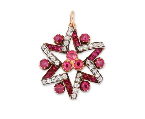 A late 19th century ruby and diamond pendant,&nbsp;of star form, with a trefoil of rubies in clawed collets to openwork ruby 