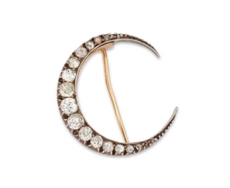 A late Victorian diamond crescent brooch,&nbsp;with a row of graduated old cut and rose cut diamonds mounted in silver backed