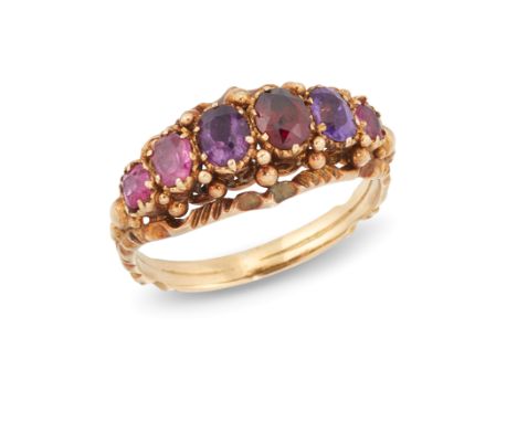 A Victorian ruby, amethyst and garnet six stone ring, of half-hoop design, one stone replaced, to a reeded hoop, ring size K
