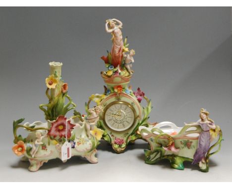 A German porcelain cased mantel clock, having a paper dial with Roman numerals, the whole with floral encrusted decoration, s