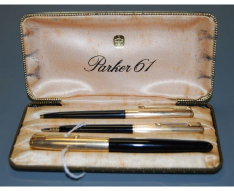 A Parker 61 1/10 12 carat rolled gold three pen set to include fountain pen, ball pen, and propelling pencil in silk lined bo