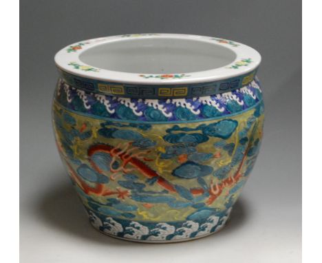 A reproduction Chinese style jardiniere, enamel decorated with dragon chasing a pearl within Greek Key border, dia.37cm