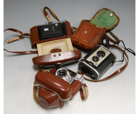 A Zeiss Ikon Nettar camera, in fitted leather case; together with a Braun Paxette camera; and a Kodak Potik Instamatic etc