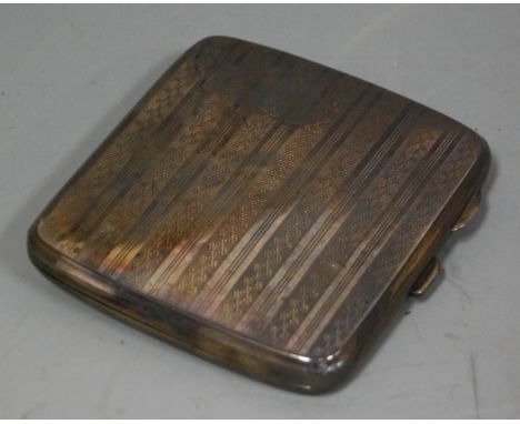 A George V silver pocket cigarette case, having all-over engine turned decoration and gilt interior