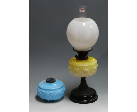 A Victorian oil lamp, having opalescent glass shade above yellow tinted glass font, on brass pedestal base; together with one