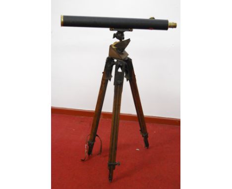 A circa 1900 lacquered brass and leather clad telescope by Broadhurst &amp; Clarkson, with various optics and lenses, stamped