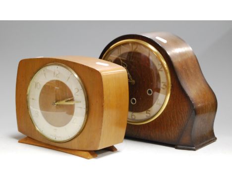 A 1950s Smiths oak cased mantel clock, having chiming movement; together with one other Smiths mantel clock (2)