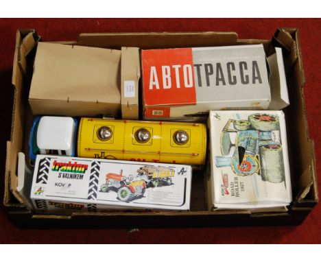 One box containing six various boxed and loose tinplate items to include a Kovap tractor and trailer, Kovap tinplate 1927 rol