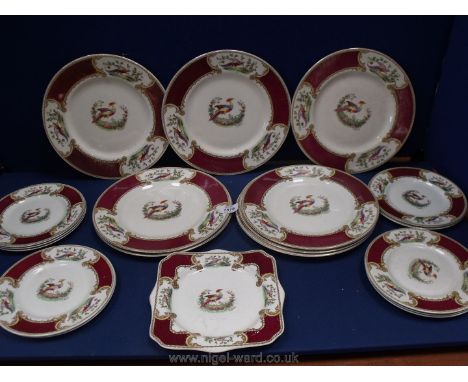 A quantity of Myott Plates with hand painted oriental Pheasant design to centre and panels around the rim with dark red borde