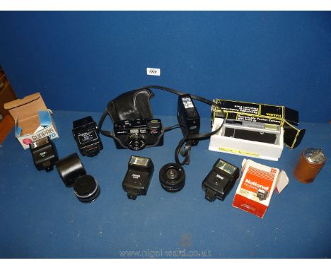 A Minolta camera, boxed Halina pocket camera, flash units. etc.,