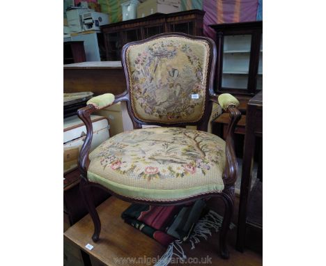 An elegant framed, broad seated Elbow Chair having cabriole front legs and swept rear legs, the seat and back with tapestry a