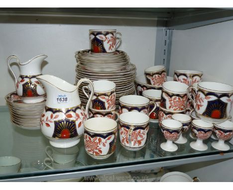 An Imari style teaset, bread and butter plates, small plates, breakfast cups, coffee cups, egg cups, saucers etc, two cups an