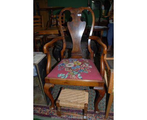 A very elegant Mahogany and Walnut framed Elbow Chair having shaped splat, surmounted by a shell carving, standing on cabriol