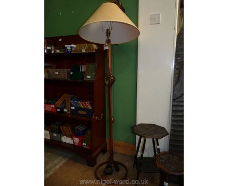 A bronzed based Standard Lamp, the pillar with twist detail and complete with cream/beige shade, 54 1/2'' high