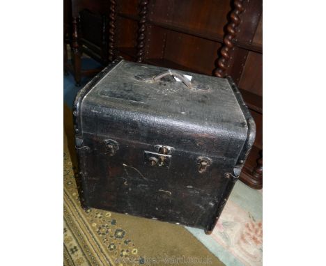 A small black Trunk, 17 1/2'' wide x 17 3/4'' high x 18'' deep