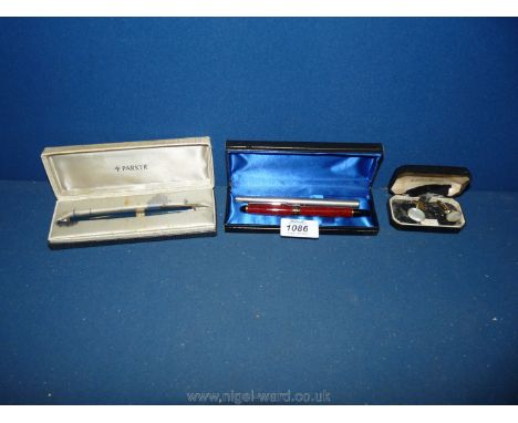 A cased old Parker Fountain Pen having old rib bar filled 1960's together with a Parker Roller Ball Gulf Company and a pair o
