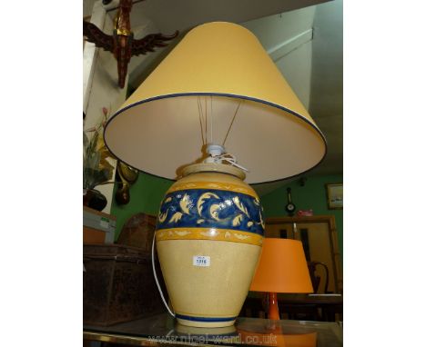 A large yellow and blue Louis Drimmer table lamp and matching shade.