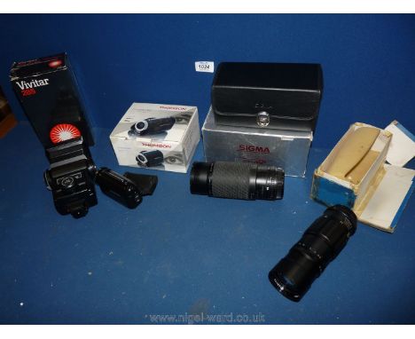 A Vivitar 285 zoom Thyristor automatic flash, a Sigma 75-300 zoom lens in new case and box, Thomson Camescope for digital vid