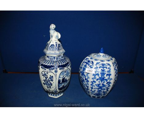 Two blue and white Ginger Jars, one by Delft with dog finial to lid, 13'' and 10 1/2''