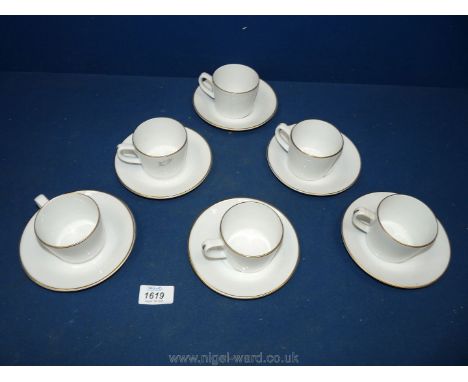 A Royal Worcester porcelain coffee set, including six cups and six saucers, white, gold rimmed.